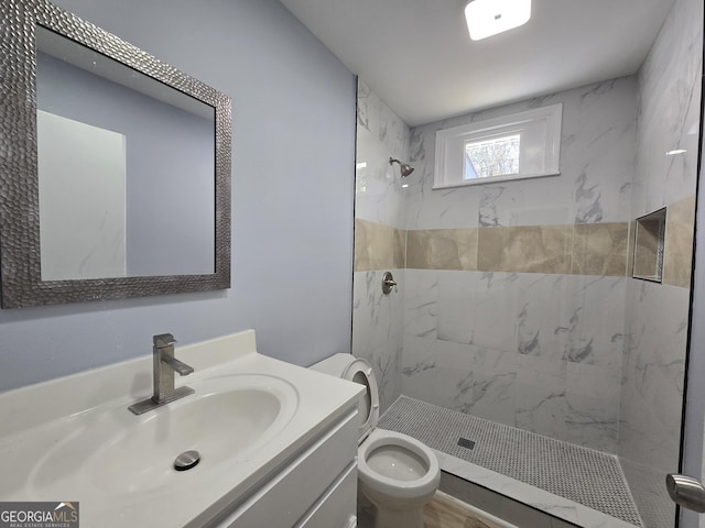 full bath with toilet, a stall shower, and vanity