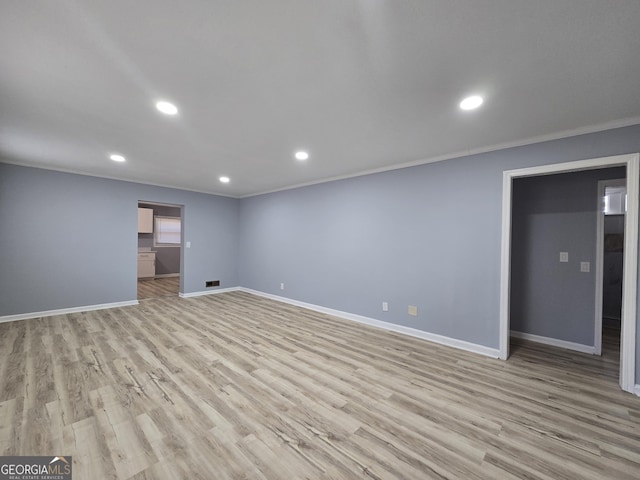 interior space featuring ornamental molding, recessed lighting, baseboards, and light wood finished floors