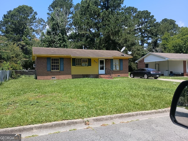 single story home with crawl space, brick siding, a front lawn, and fence