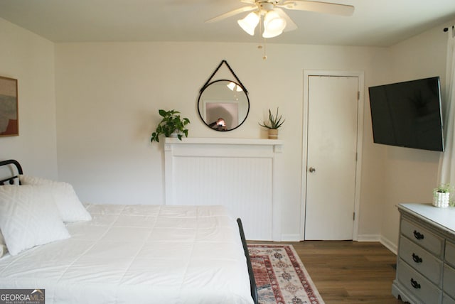 bedroom with ceiling fan and wood finished floors