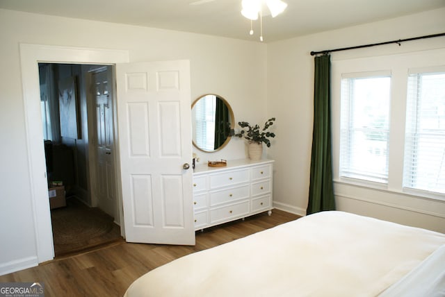 bedroom with dark wood-type flooring