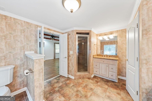 bathroom with ornamental molding, a stall shower, toilet, and wallpapered walls