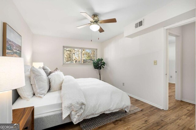 dining space with crown molding and light wood-style floors