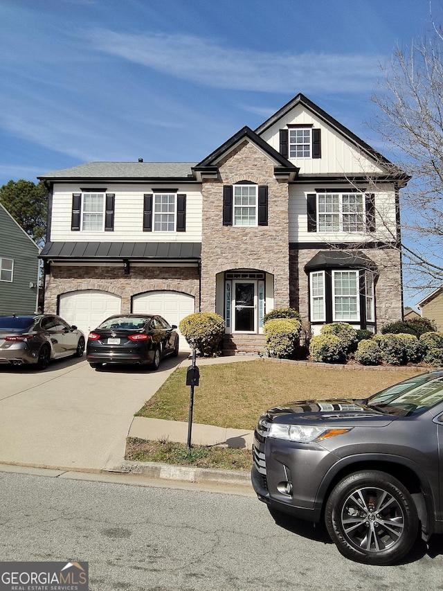 view of front of home featuring an attached garage, stone siding, concrete driveway, board and batten siding, and a standing seam roof