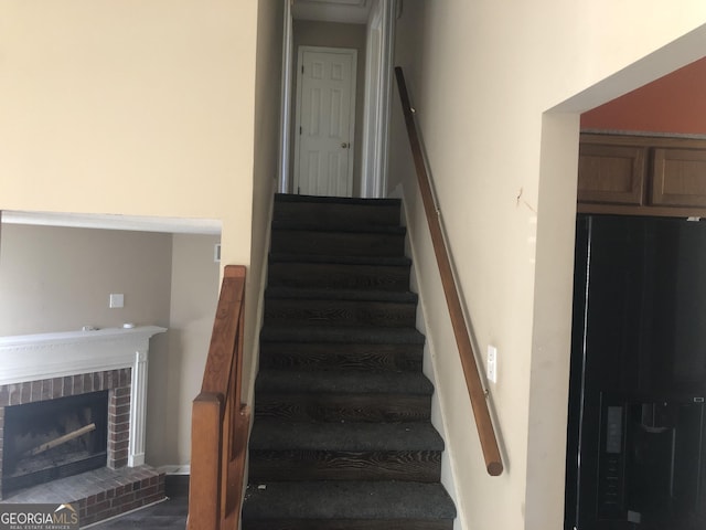 stairway with a fireplace