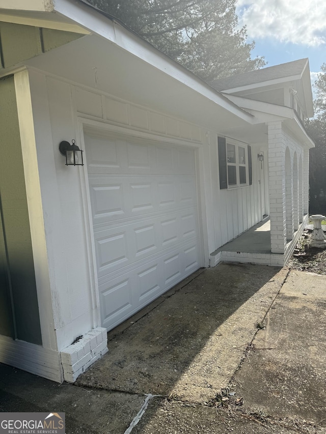 exterior space with a garage and driveway