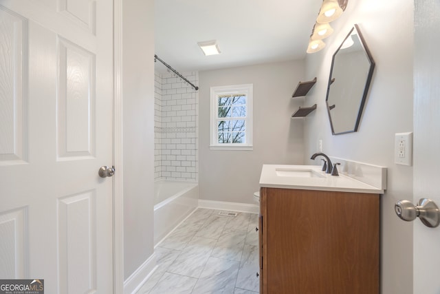 full bath with baseboards, bathing tub / shower combination, toilet, marble finish floor, and vanity