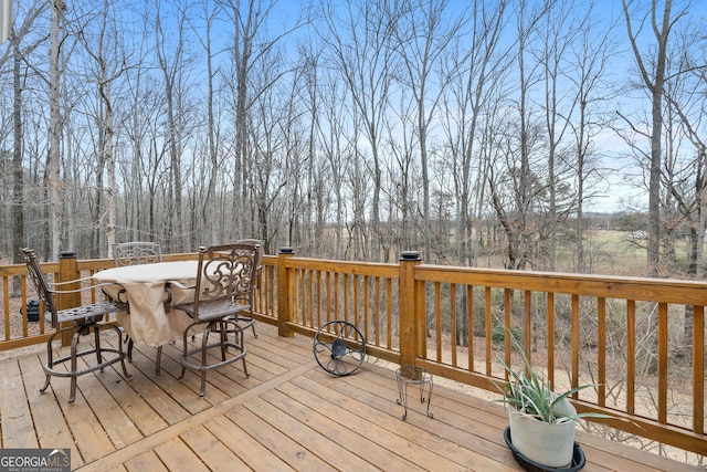 deck featuring outdoor dining area