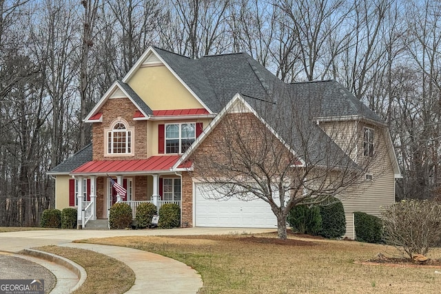 view of front of house featuring a shingled roof, a standing seam roof, metal roof, and stucco siding