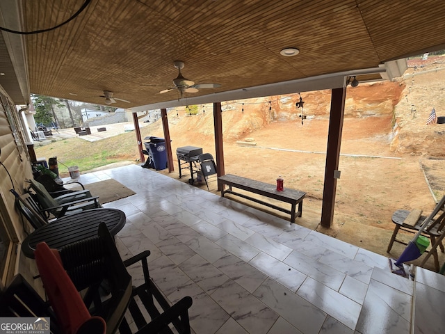 view of patio / terrace with a ceiling fan