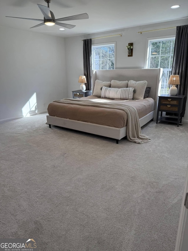 bedroom featuring multiple windows, carpet, a ceiling fan, and recessed lighting