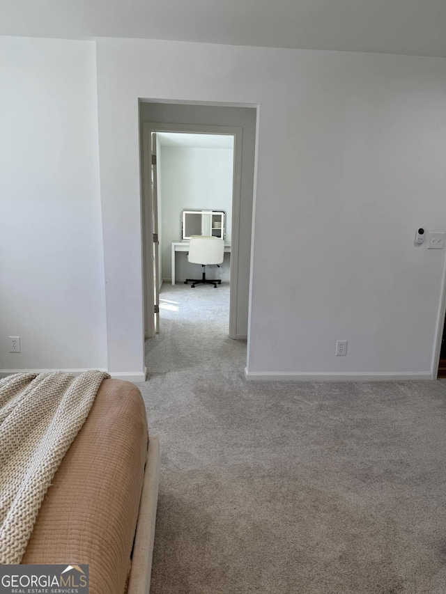 carpeted bedroom with baseboards