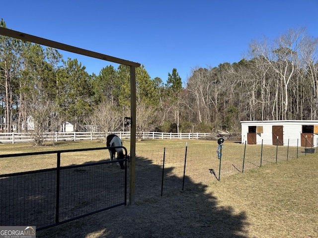 view of home's community featuring fence