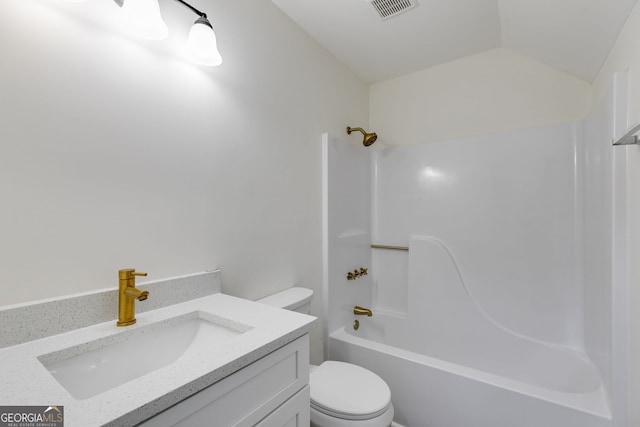 bathroom featuring lofted ceiling, shower / bath combination, visible vents, toilet, and vanity