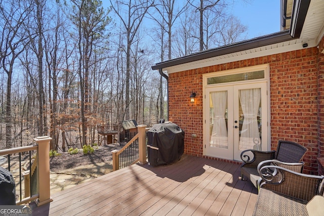 deck with area for grilling and french doors