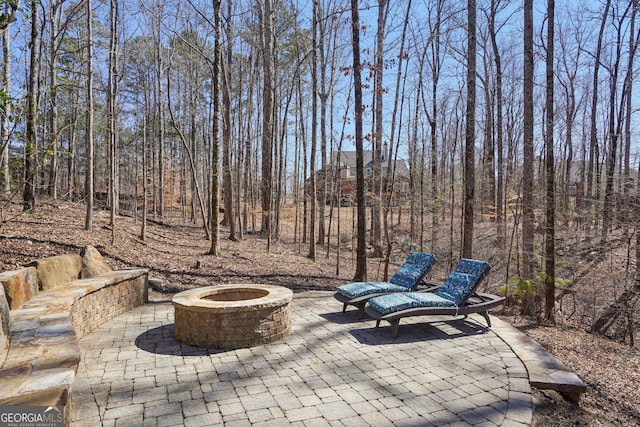 view of patio / terrace with a fire pit