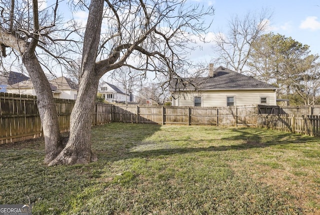 view of yard with a fenced backyard