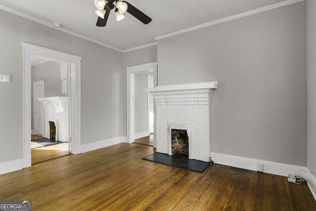 unfurnished living room featuring a brick fireplace, visible vents, and wood-type flooring