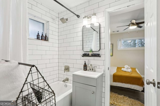 1415 Vesta Ave, Atlanta, GA 30344 - ensuite bathroom featuring vanity, bathtub / shower combination, and a ceiling fan