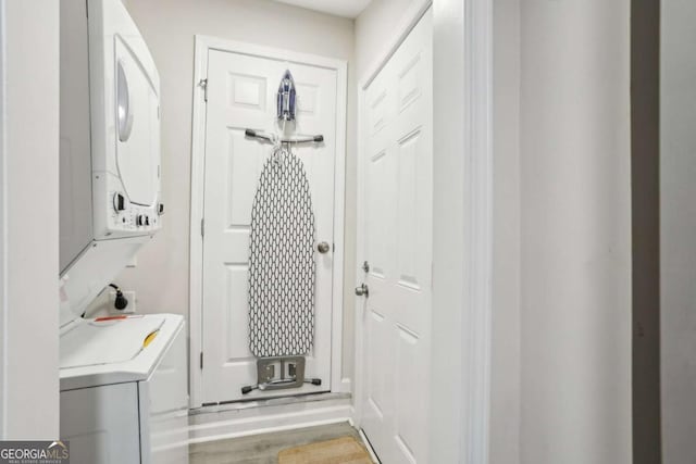 1415 Vesta Ave, Atlanta, GA 30344 - laundry room featuring stacked washer / dryer and wood finished floors