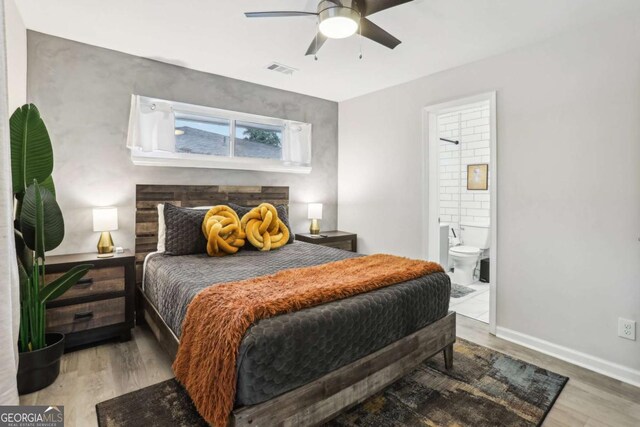 1415 Vesta Ave, Atlanta, GA 30344 - bedroom with wood finished floors, ensuite bathroom, and ceiling fan