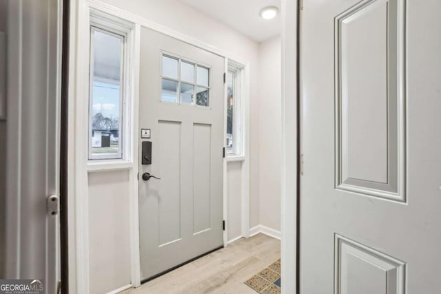 1415 Vesta Ave, Atlanta, GA 30344 - foyer with light wood-style flooring and baseboards
