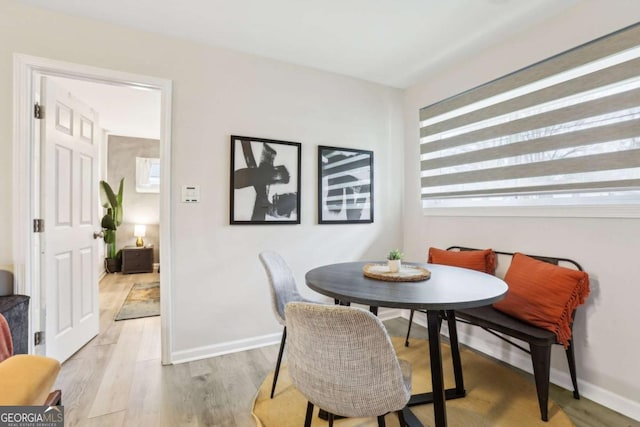 1415 Vesta Ave, Atlanta, GA 30344 - dining room with light wood-type flooring and baseboards