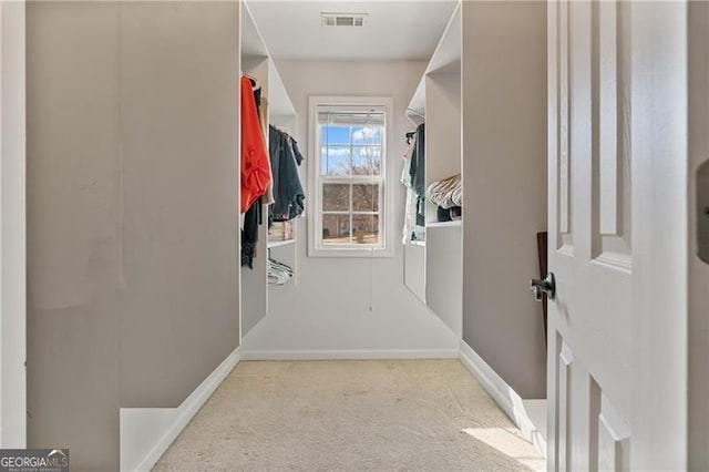 walk in closet with carpet and visible vents