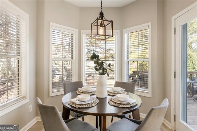 dining space featuring baseboards