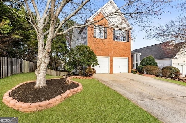 traditional home with brick siding, concrete driveway, a front yard, fence, and a garage