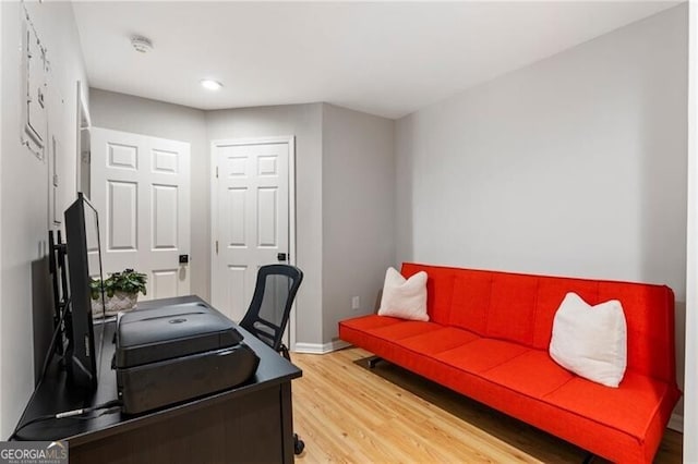 office area with light wood-type flooring, baseboards, and recessed lighting