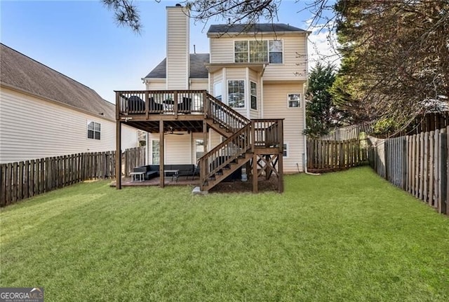 back of property featuring stairs, a yard, a fenced backyard, and a wooden deck