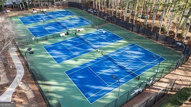 view of sport court featuring fence