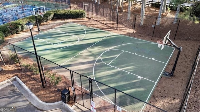 view of sport court with community basketball court and fence