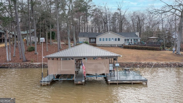 dock area with a water view and boat lift