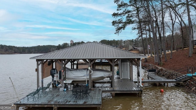 view of dock featuring boat lift and a water view