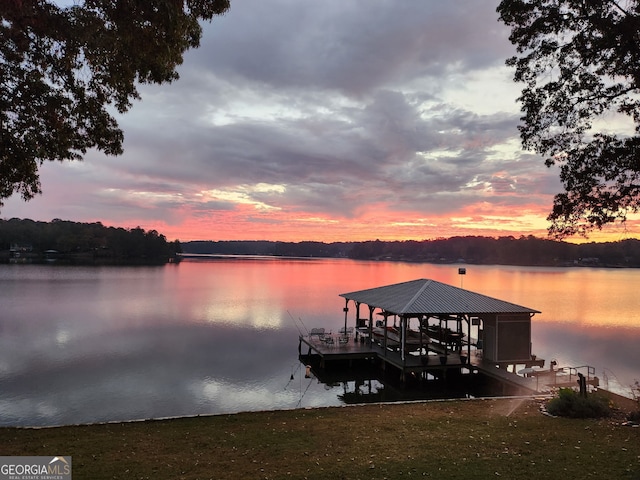 dock area with a water view and boat lift