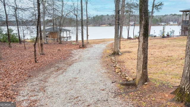 exterior space featuring a water view and driveway