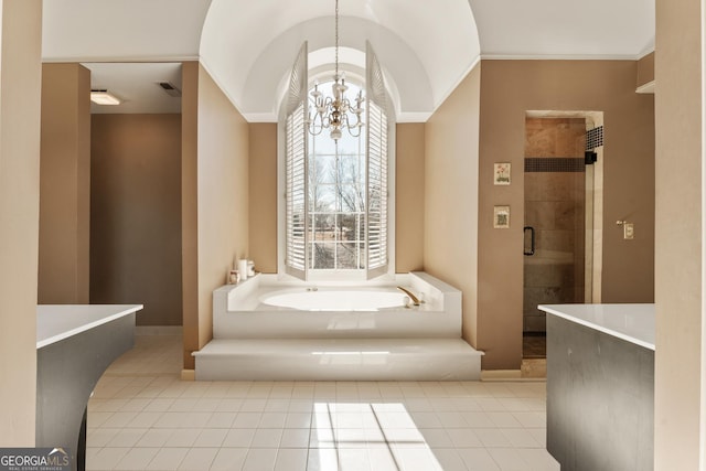 bathroom with a bath, a stall shower, crown molding, a notable chandelier, and tile patterned floors