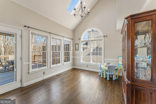 unfurnished sunroom with a notable chandelier, visible vents, and vaulted ceiling