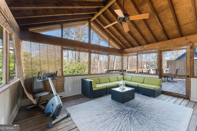 sunroom / solarium with a wealth of natural light, wood ceiling, lofted ceiling with beams, and a ceiling fan