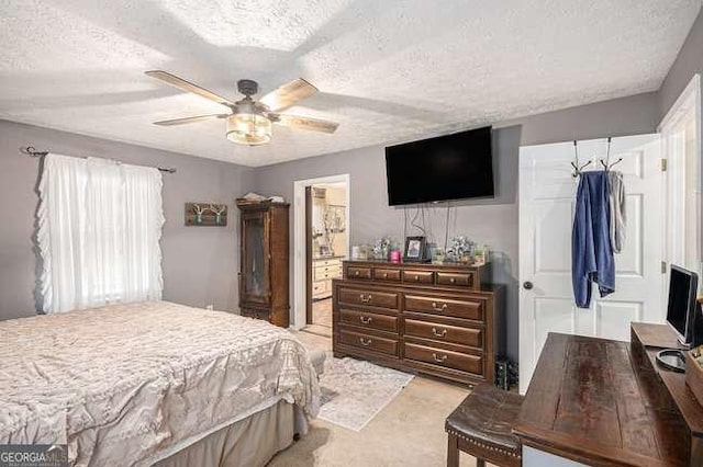 bedroom with ceiling fan and a textured ceiling