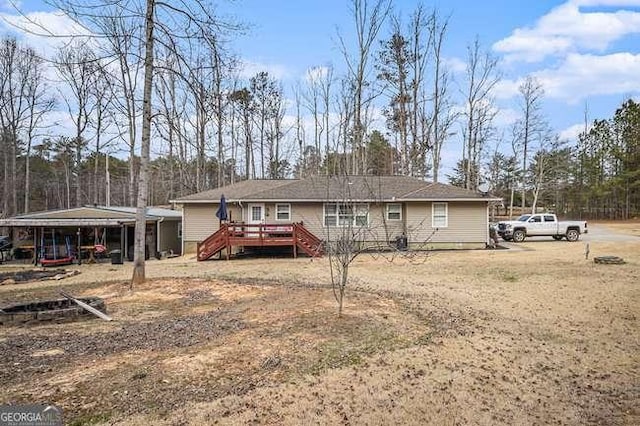 rear view of property with a deck