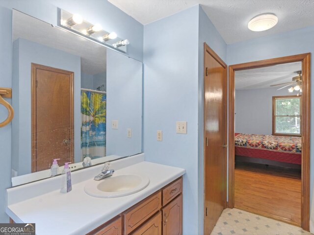 2643 Rocky Creek Rd, Hampton, GA 30228 - full bath featuring connected bathroom, a shower with curtain, tile patterned floors, vanity, and a ceiling fan