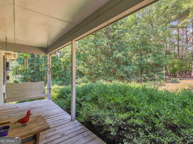 2643 Rocky Creek Rd, Hampton, GA 30228 - wooden deck featuring a wooded view