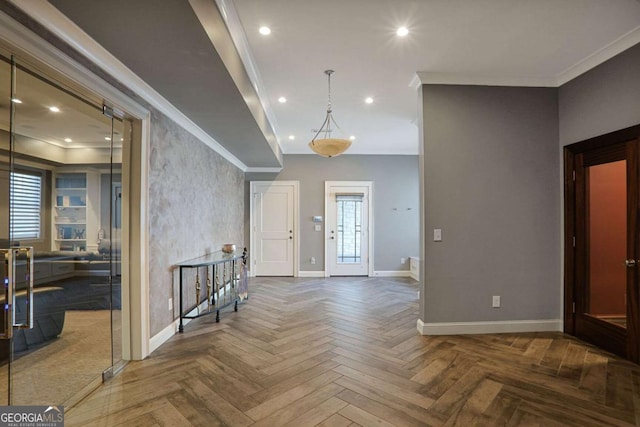 entrance foyer with plenty of natural light, recessed lighting, crown molding, and baseboards