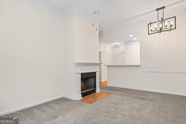 unfurnished living room with crown molding, a fireplace with flush hearth, and baseboards