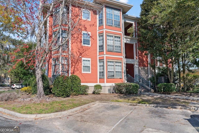 view of property with uncovered parking