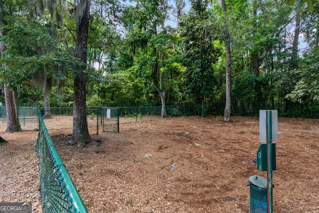 view of community with fence