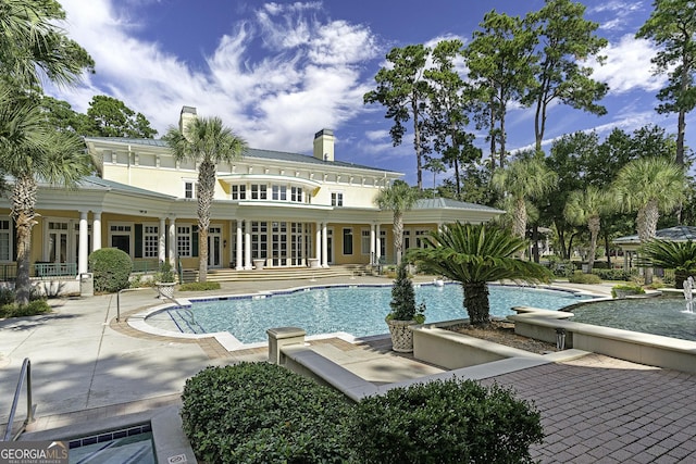 pool featuring a patio area